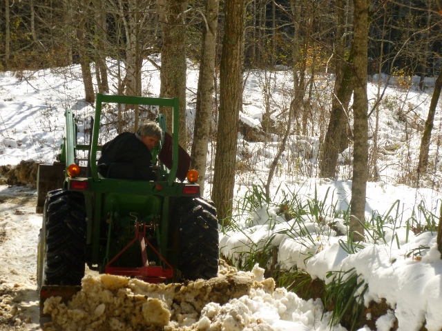 Tom on the tractor keeping our roads open