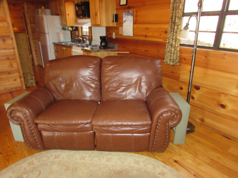 Cozy up by the fireplace in the leather loveseat